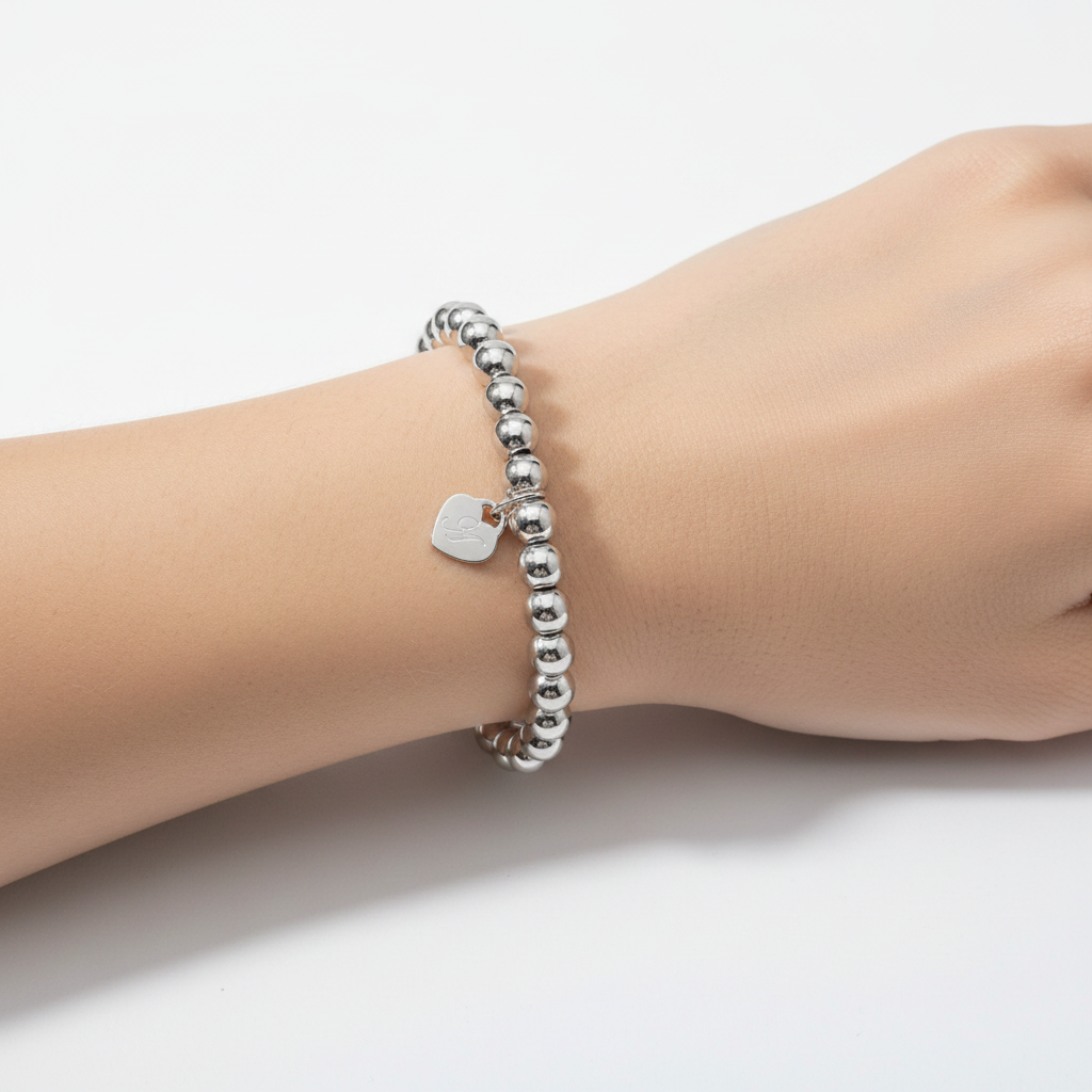 Bracciale sfere cuoricino inciso