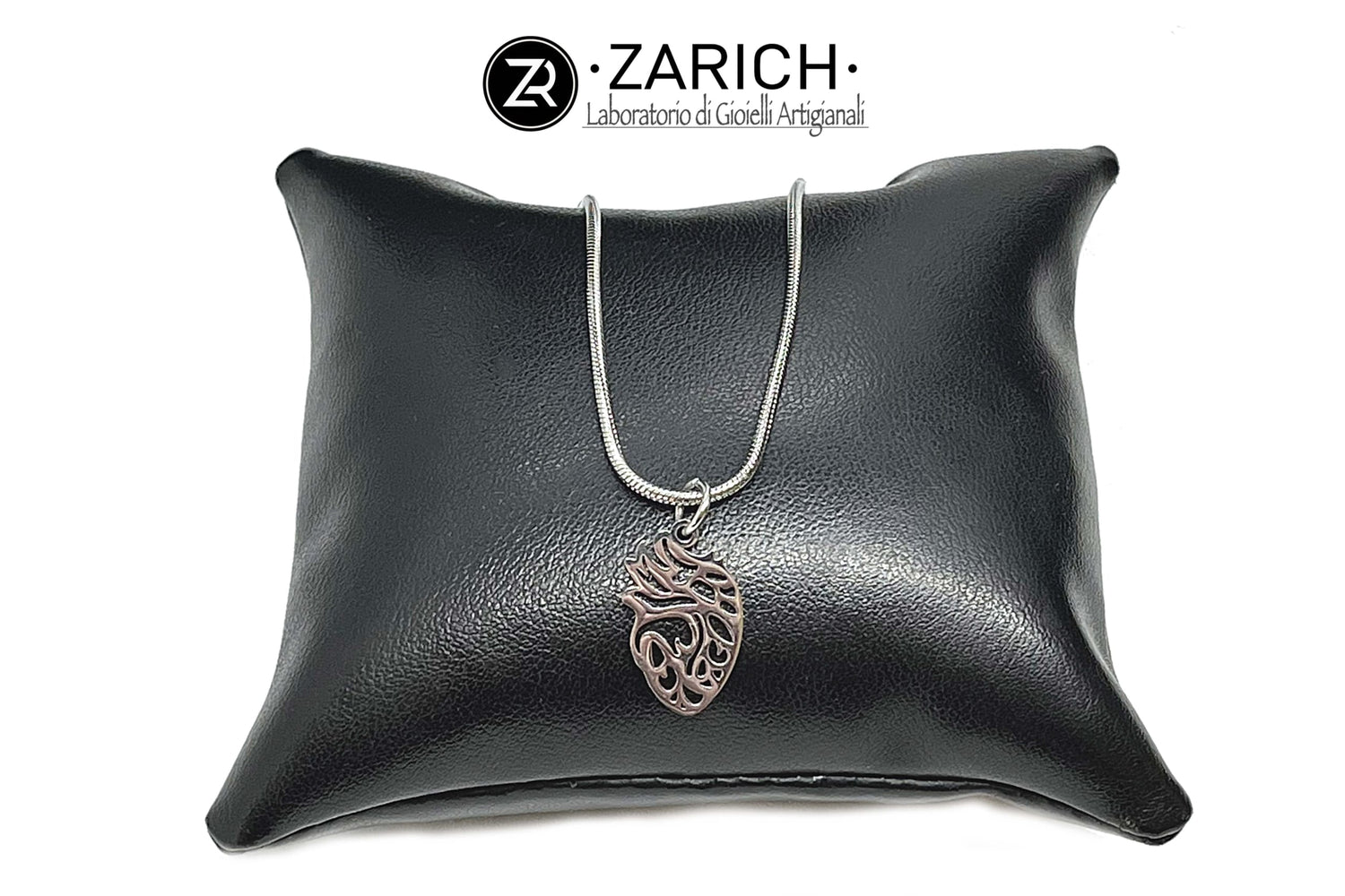 Carved anatomical heart necklace