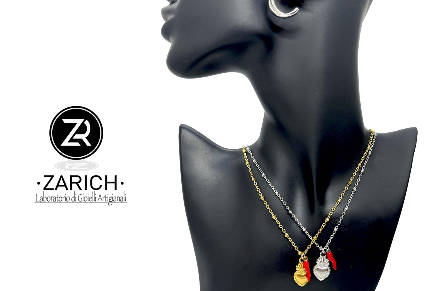 Sacred heart necklace with a little horn charm